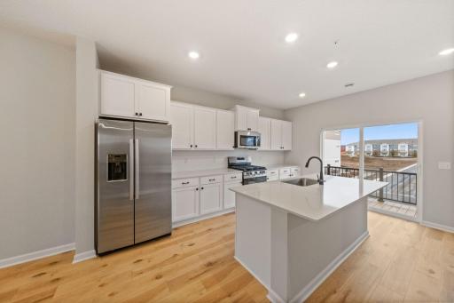 Photos of former model home, options and color selections will vary.
