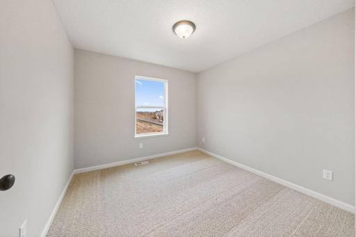 Photos of former model home, options and color selections will vary.