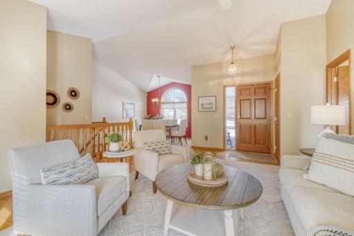 Light-filled front living room with vaulted ceilings
