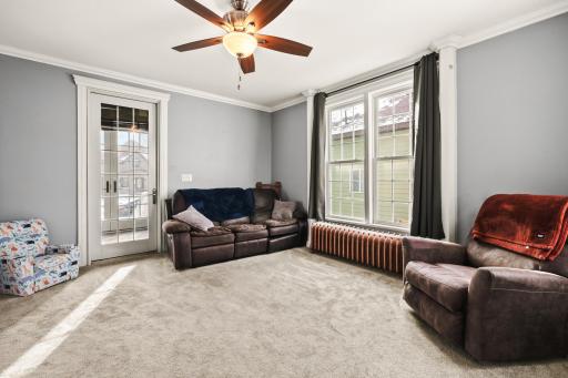 Living room opens up through the double doors to the front porch.