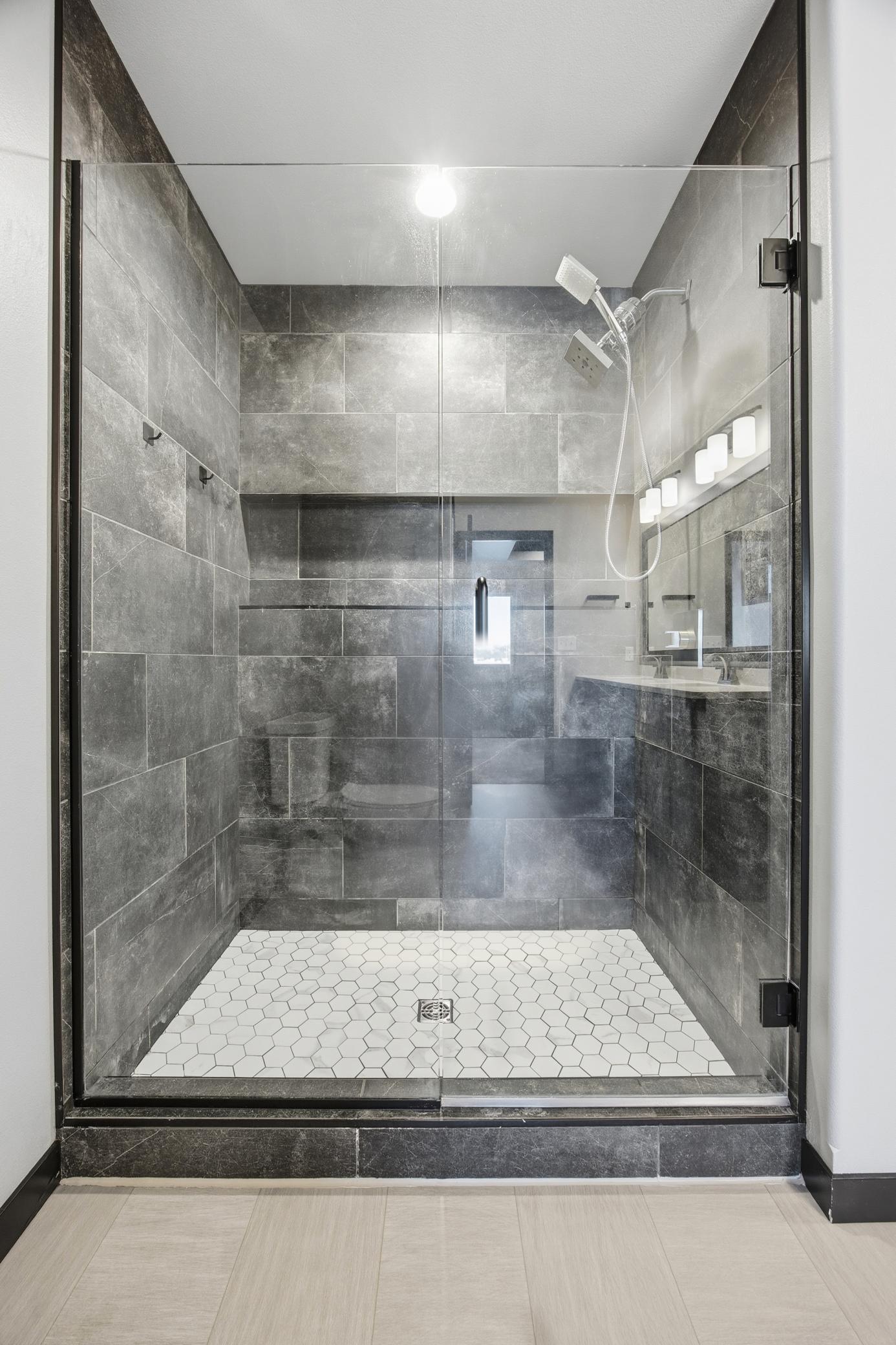 Primary bathroom features gorgeous tile shower