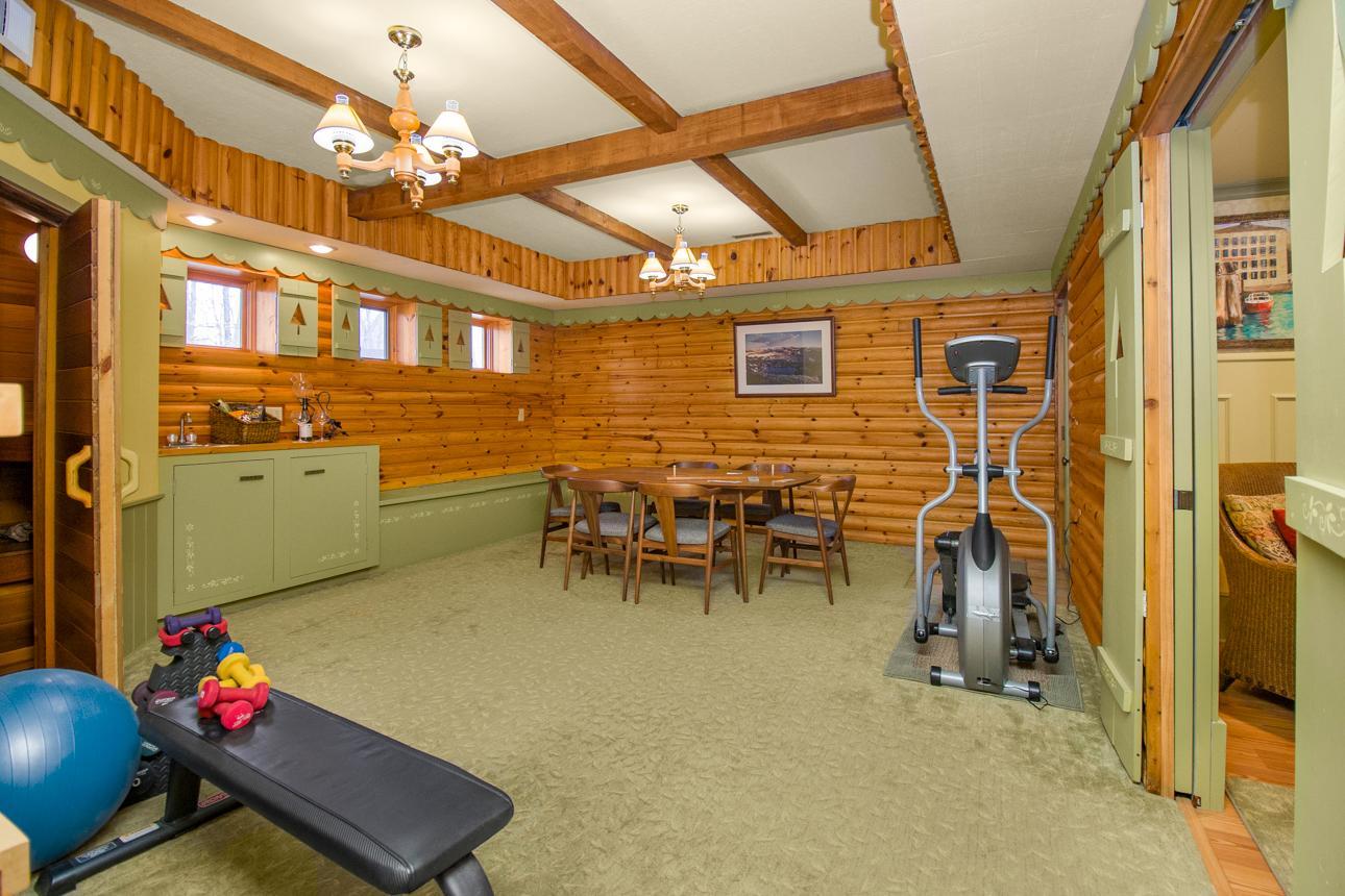 Family room with sauna and wet bar.