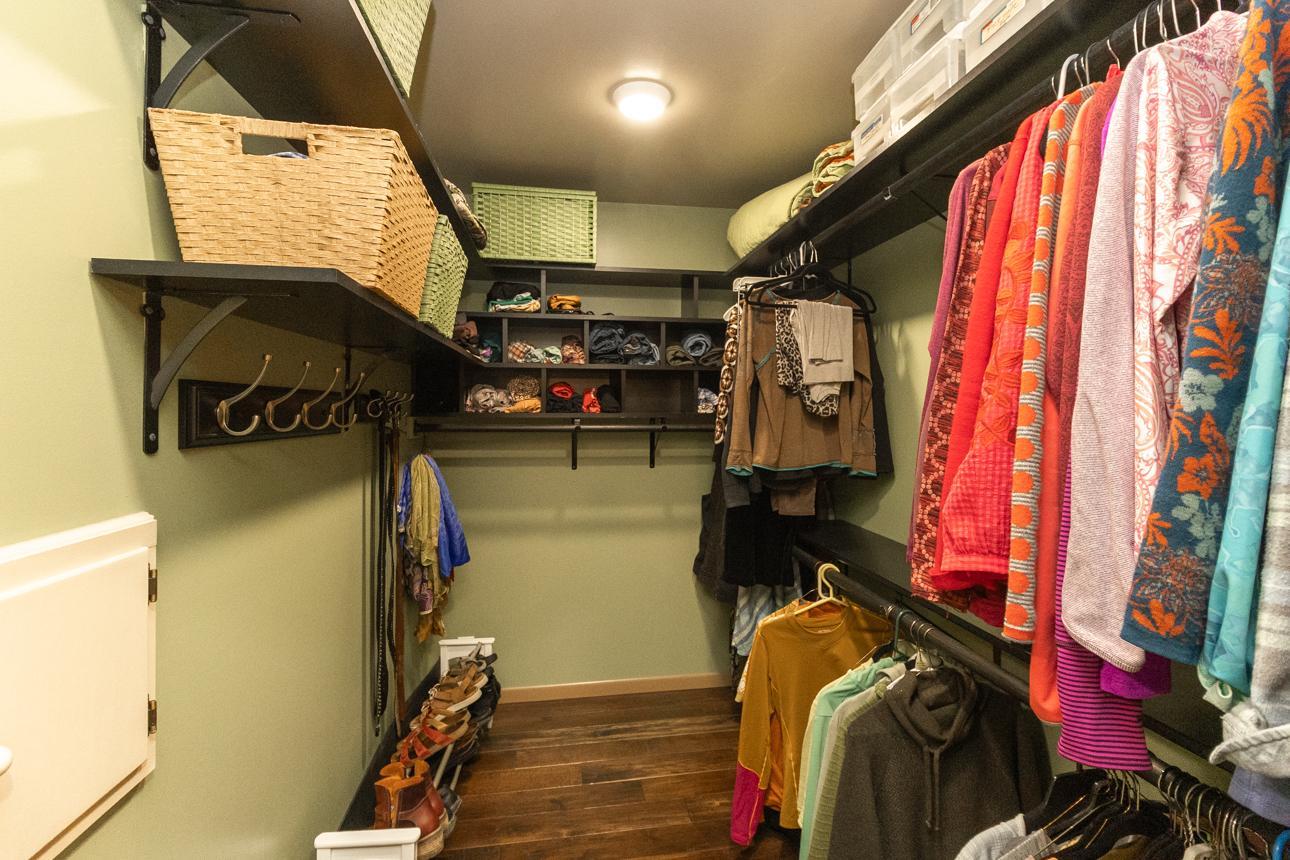 Double walk-in closet with laundry chute to the laundry room.