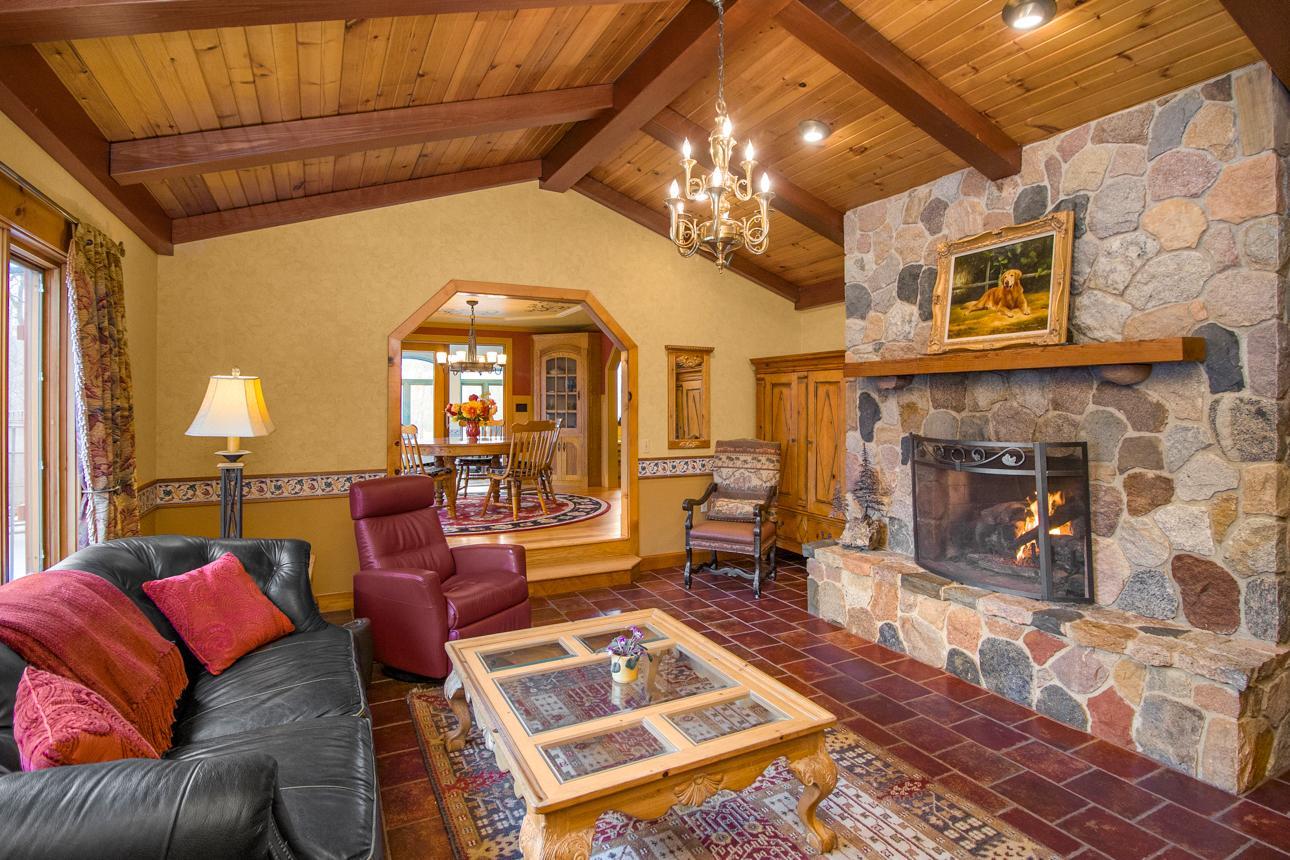 Large living room with designer gas fire place.