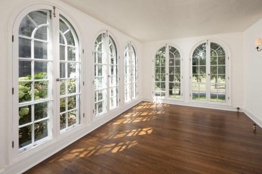 Cheerful sunroom with palladian windows and views to Isles
