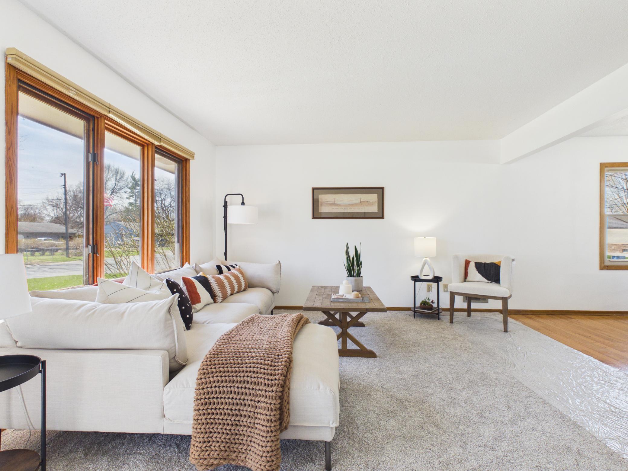 The large picture window brings the outdoors in.