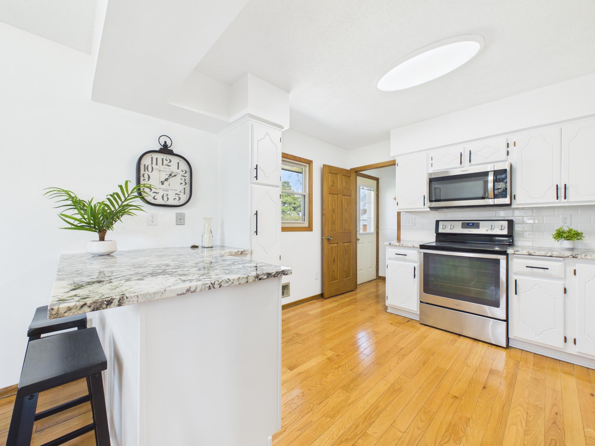 The breakfast bar is great for coffee dates, crafts, and offers ample counter space for cooking.