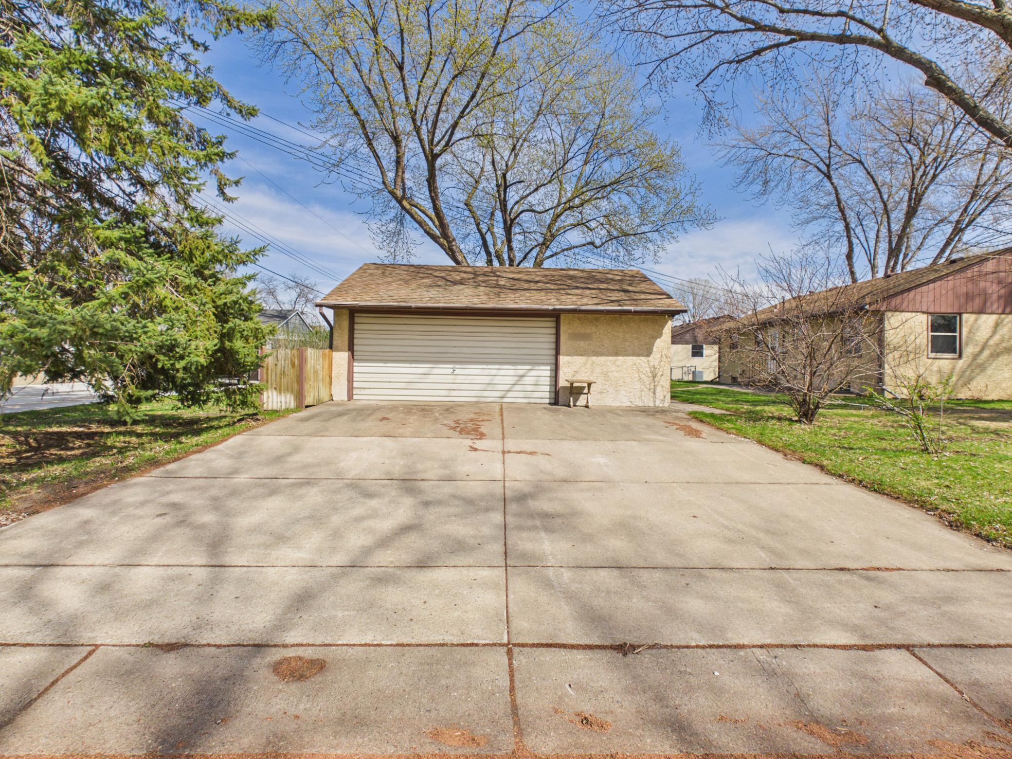 Concrete driveway to xl garage.