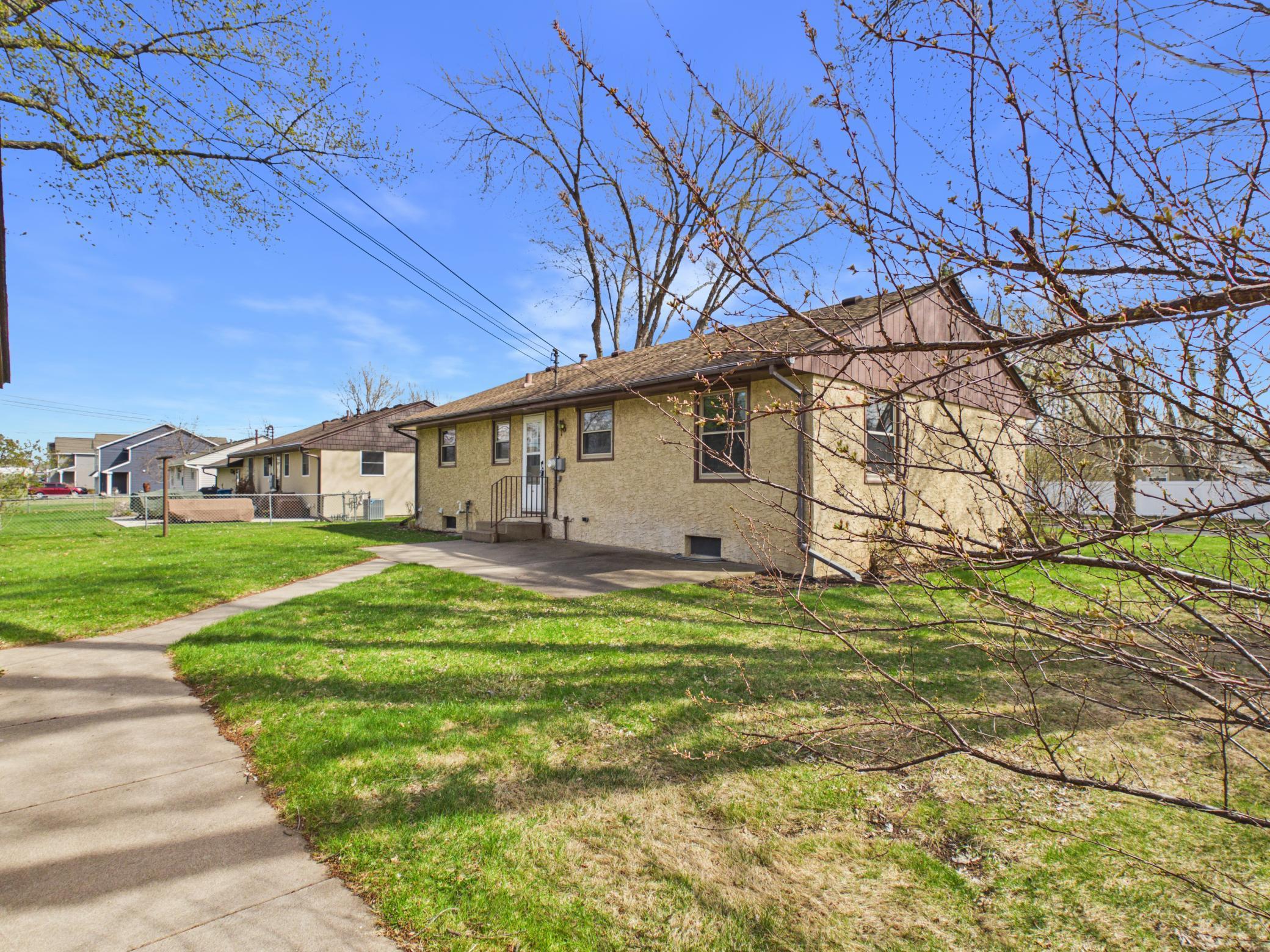 Cement patio behind the house is ready for backyard bbqs.