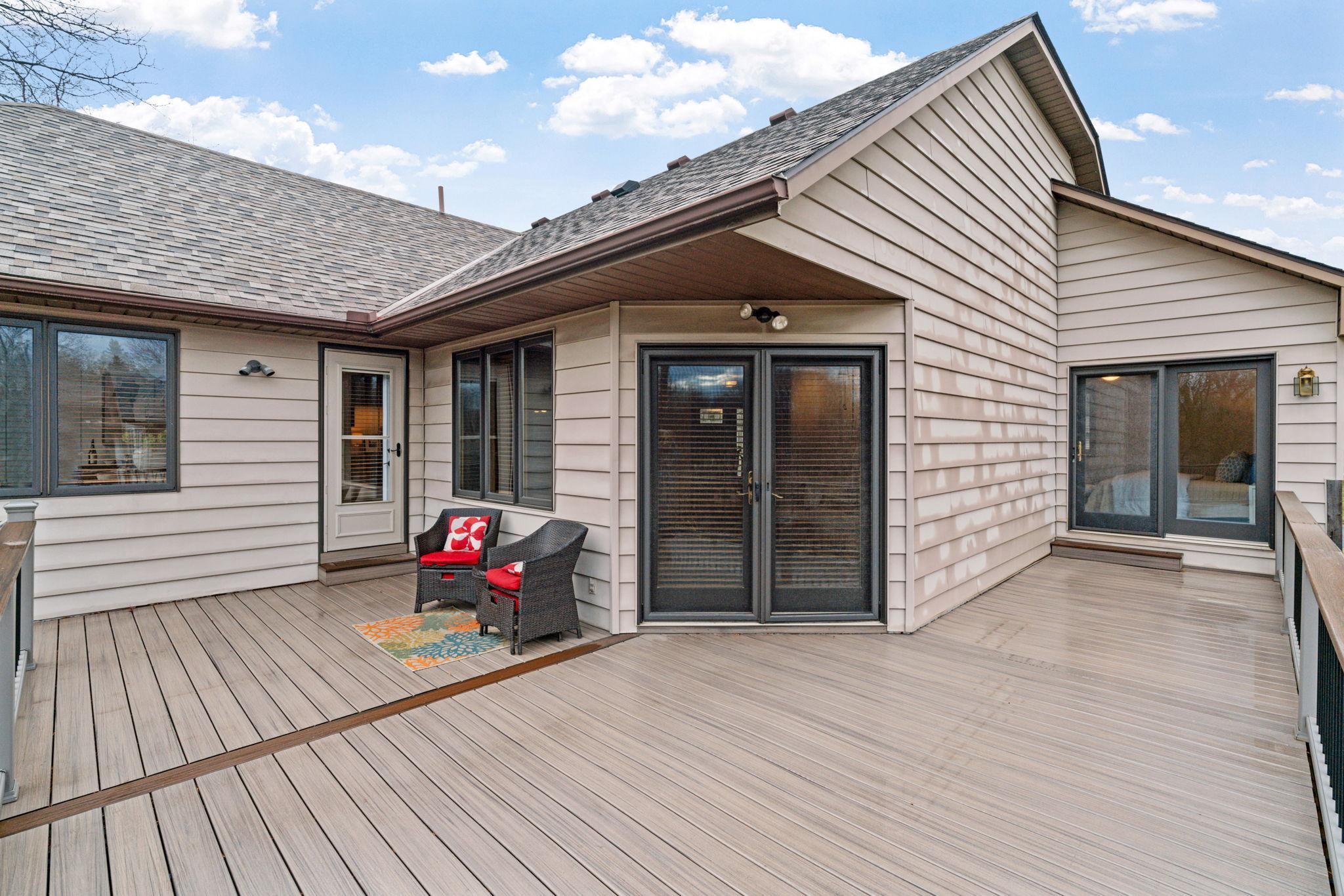 Maintenance free wrap around deck that leads from the kitchen all the way to the primary bedroom for your own little oasis.