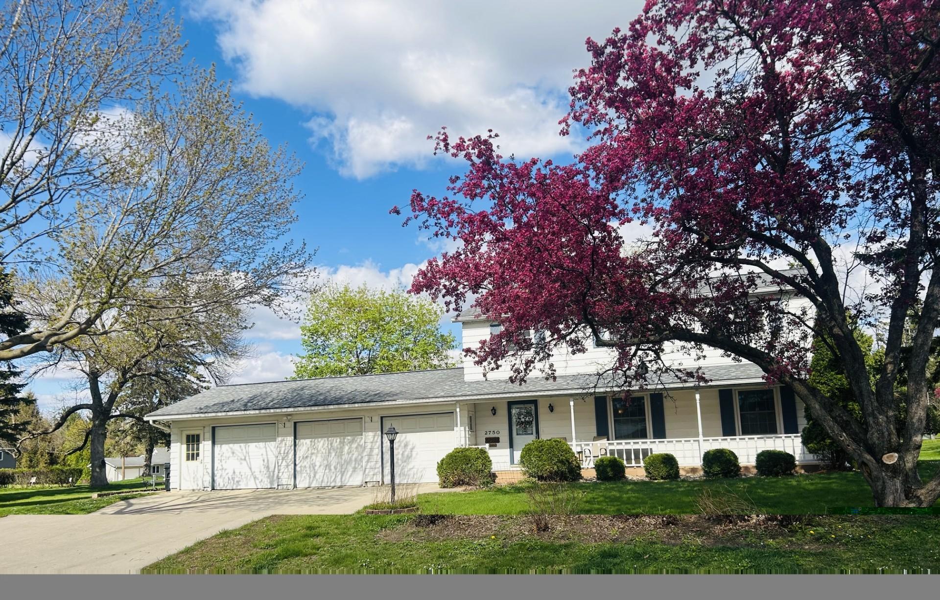 Front of House with 3 car garage and shop