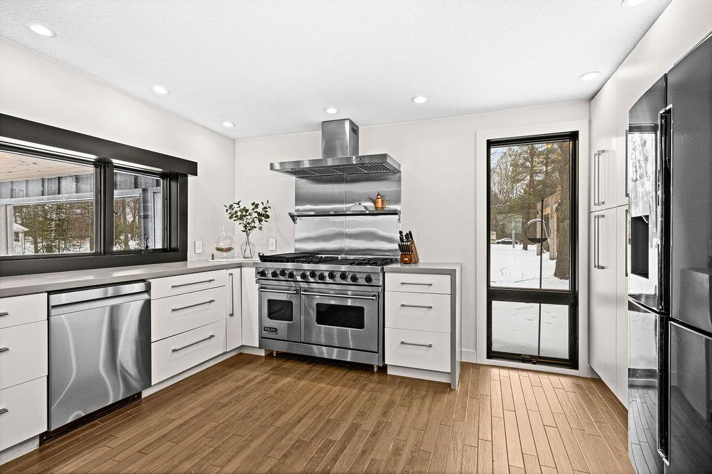 Professional-grade Viking range and stainless steel appliances complete this kitchen.