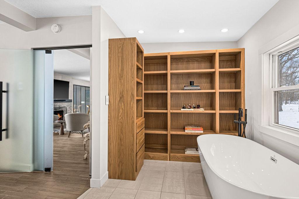 Effortlessly organize your bathroom essentials with these sleek, custom cabinets.