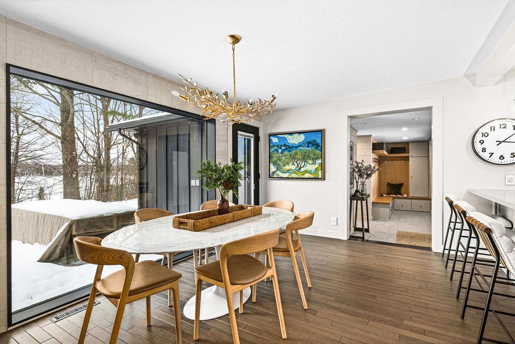 Entertain guests or simply eat your meal with views of Pokegama featuring a new light fixture.