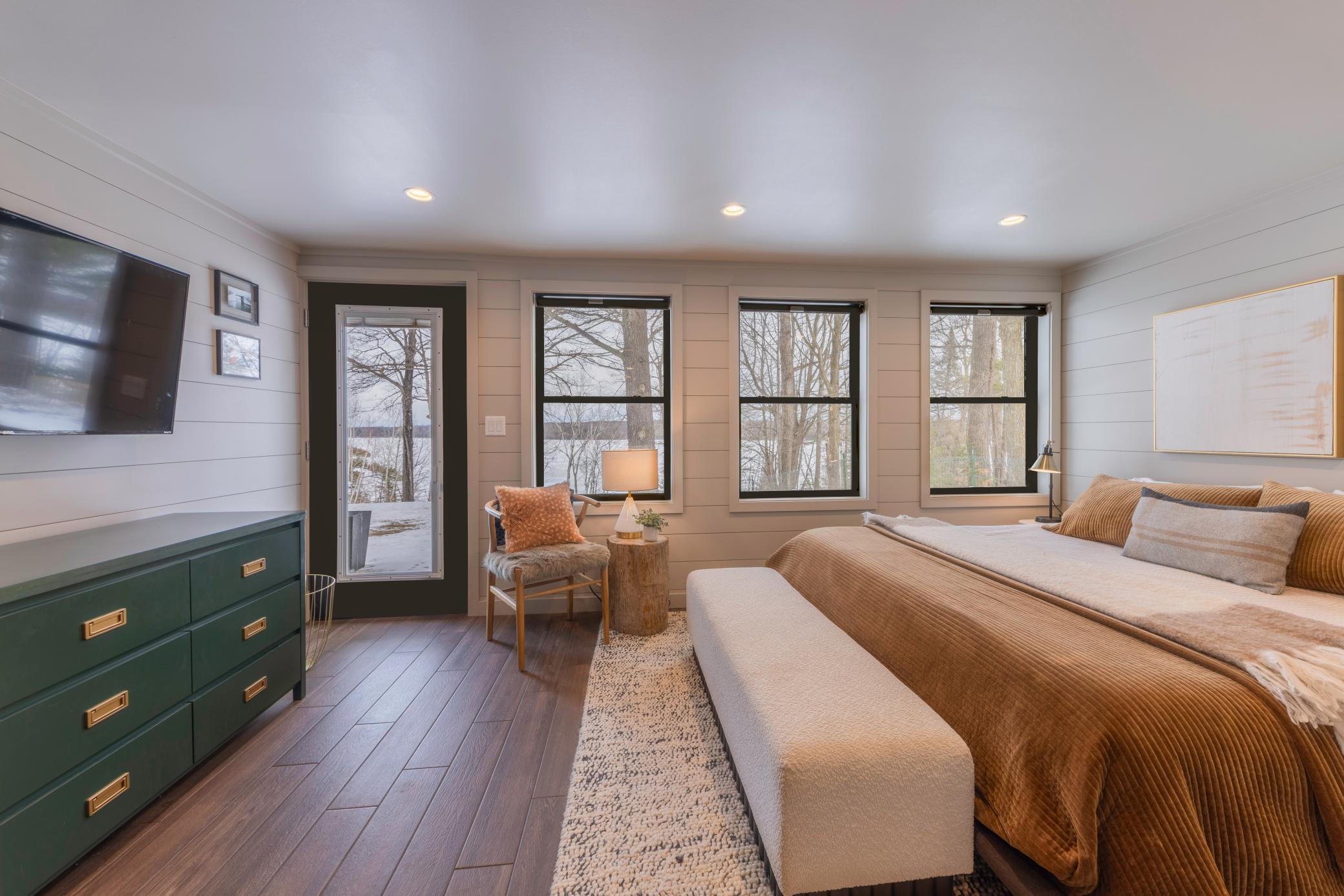 Second bedroom with door access to the back yard and lake access