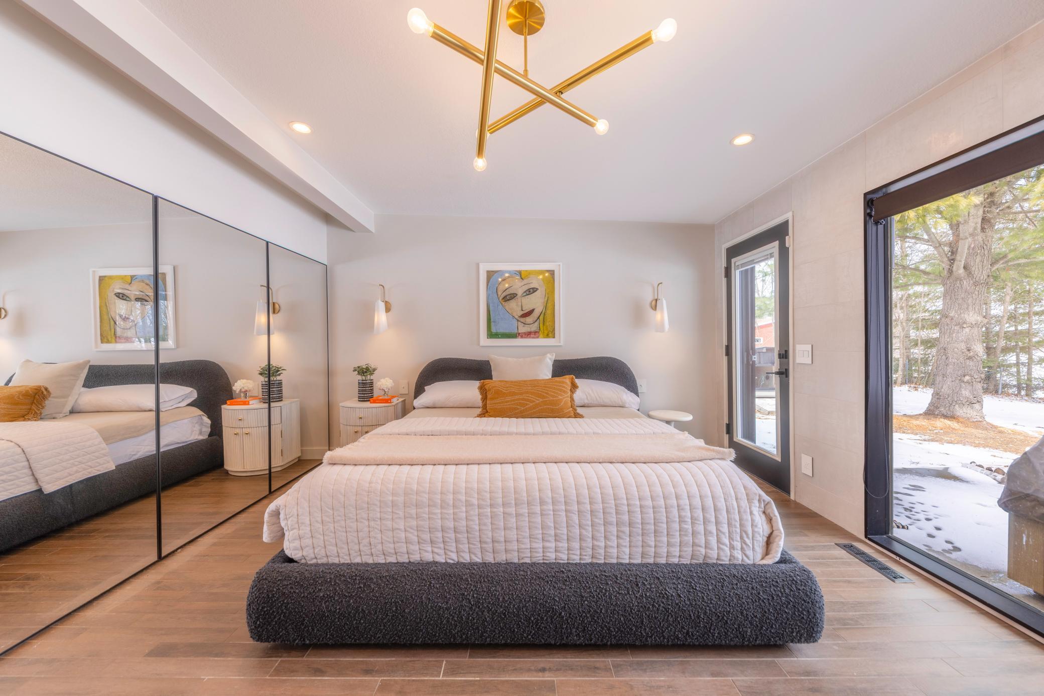 The primary suite offers a private door leads you directly to the backyard patio and serene lake access