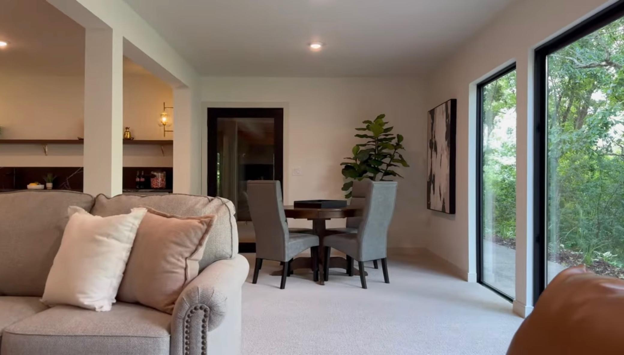 Host your friends in style with the sleek wet bar and open lounge area.