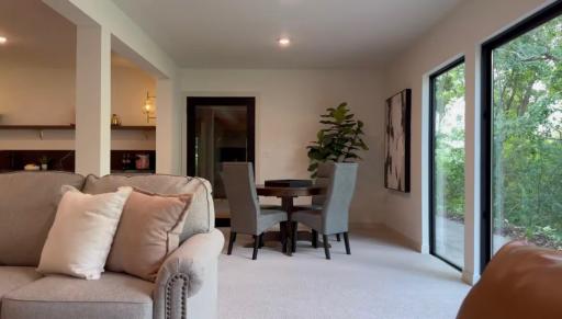 Host your friends in style with the sleek wet bar and open lounge area.