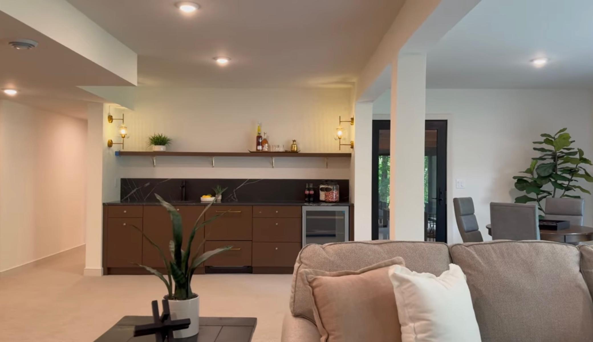 Lower Level Lounge with Wet Bar + Guest Suites.