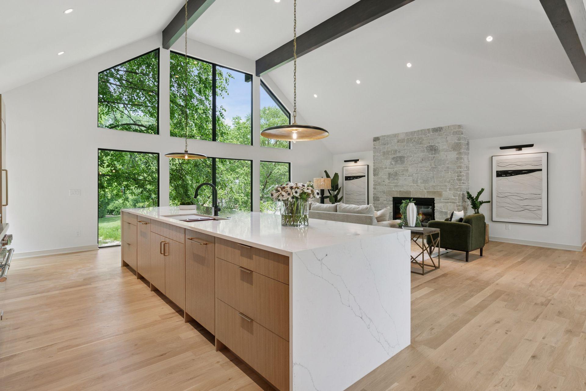 Where timeless design meets modern luxury. Just look at that custom kitchen and living flow!