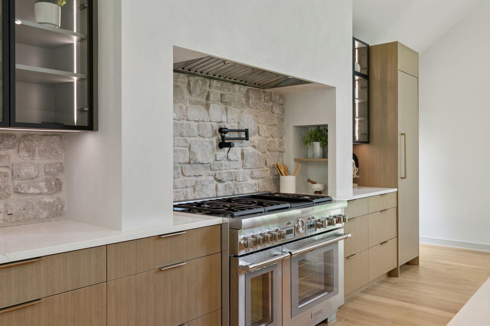 Stunning commercial grade counters and tumbled Silver Ledge Stone Backsplash