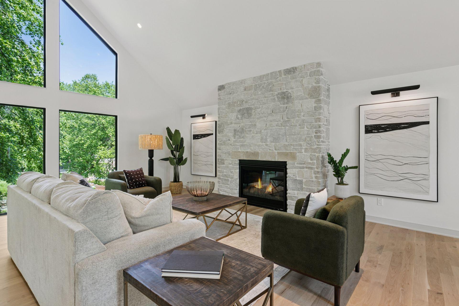 A custom designed Tumbled Silver Edge Stone centers the living space.