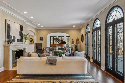 Lake facing designer living room with oversized front patio