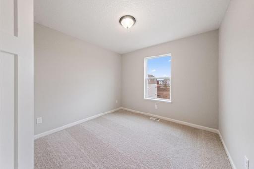 Photos of former model home, options and color selections will vary.