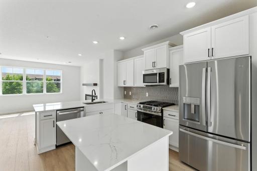 All Pictures are Illustration Only - The Athens Kitchen the cabinets in this town home are natural wood tone