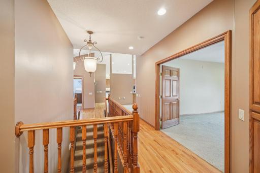 Hard wood floors, hallway to primary bedroom
