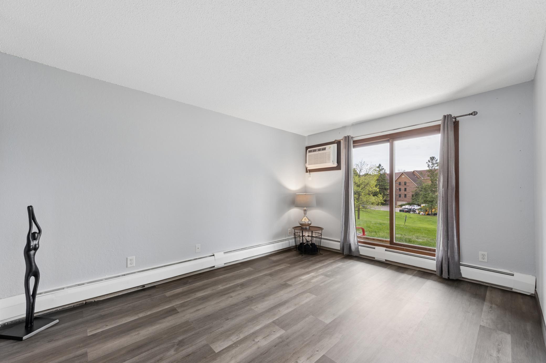 Impressively sized private primary bedroom with brand new a/c and private patio access.