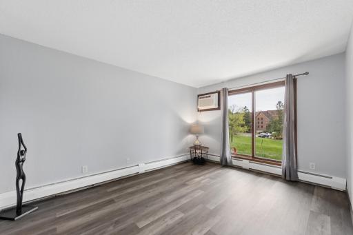 Impressively sized private primary bedroom with brand new a/c and private patio access.