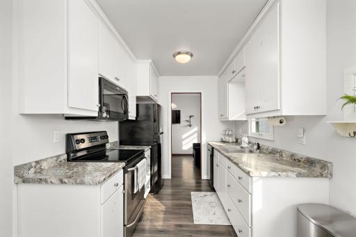 Attractive updated kitchen with new fridge in 2022 and a new microwave and dishwasher in 2024!