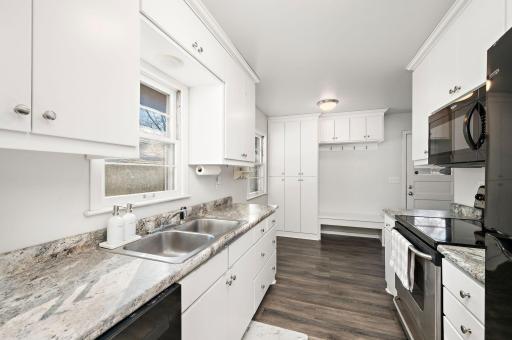 Awesome entry storage wall that could be used as a mudroom, a pantry, or a little of both!
