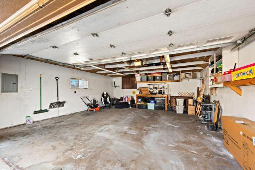Large 2-stall heated and insulated garage measures 21’ wide by 23’ deep and has a 220 outlet!