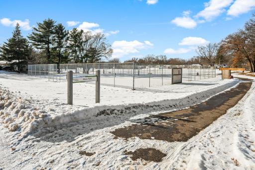 Moor Park offers ball fields, basketball, tennis, pickle ball, ice rinks, play area, picnic shelters, a large open space, and a paved walking trail loop, all just 1 block away!