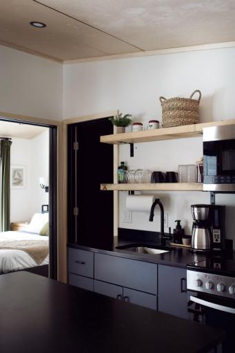 Kitchen view looking into master bedroom and bathroom