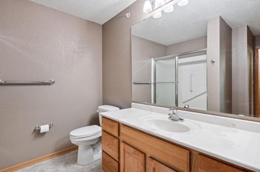 Full bath includes tons of counter space and grab bars in the shower.