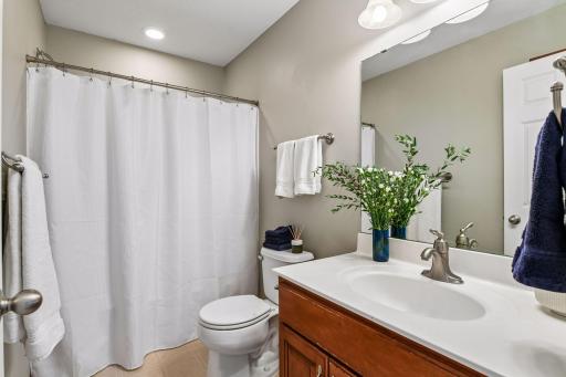 This full bath serves the three junior bedrooms upstairs.