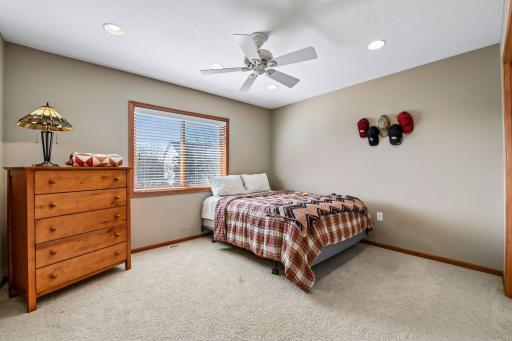 The third of the four bedrooms, this one looks out over the back yard. More recessed lights and a ceiling fan...