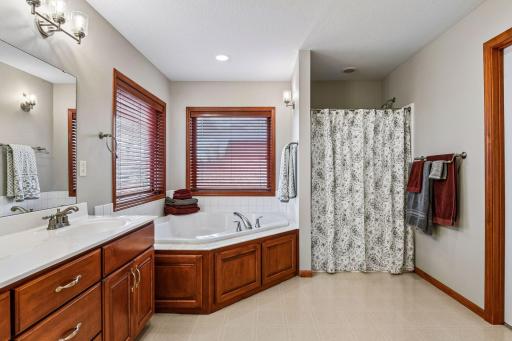 The Primary bath has a corner tub and separate shower.