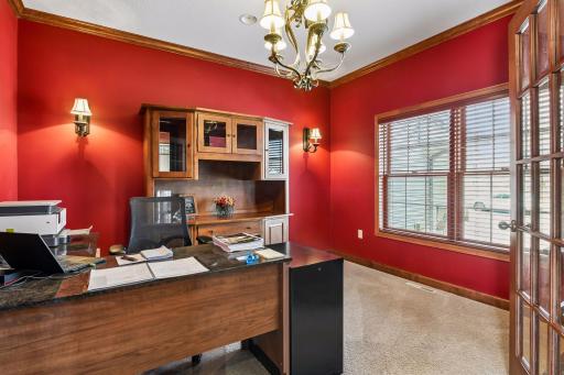 The current owner uses this room as an office as it is convenient to the front door and has natural light from the front window. Glass front French doors create privacy when needed.