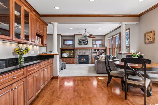 An unusual feature that adds to the greatness of this kitchen is the continuous 9+ feet of upper and lower cabinets with under cabinet lighting, glass front doors and cookbook displays, all topped in granite. And, the floors....