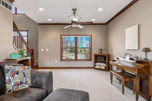 This "living" room is perfect for a piano but also serves as "simply extra space" - so nice to have abundance.