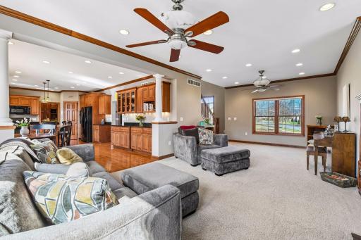 See the flow in this home. Love the 9 foot high "knock down finish" ceilings plus cove trim with LOTS of recessed lighting and cabinetry. White pillars add to the substantive nature of this home.