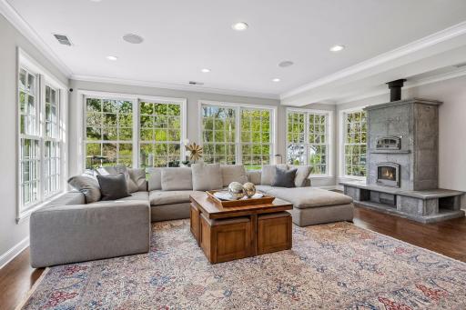 Massive family room with Tulikivi fireplace and oven
