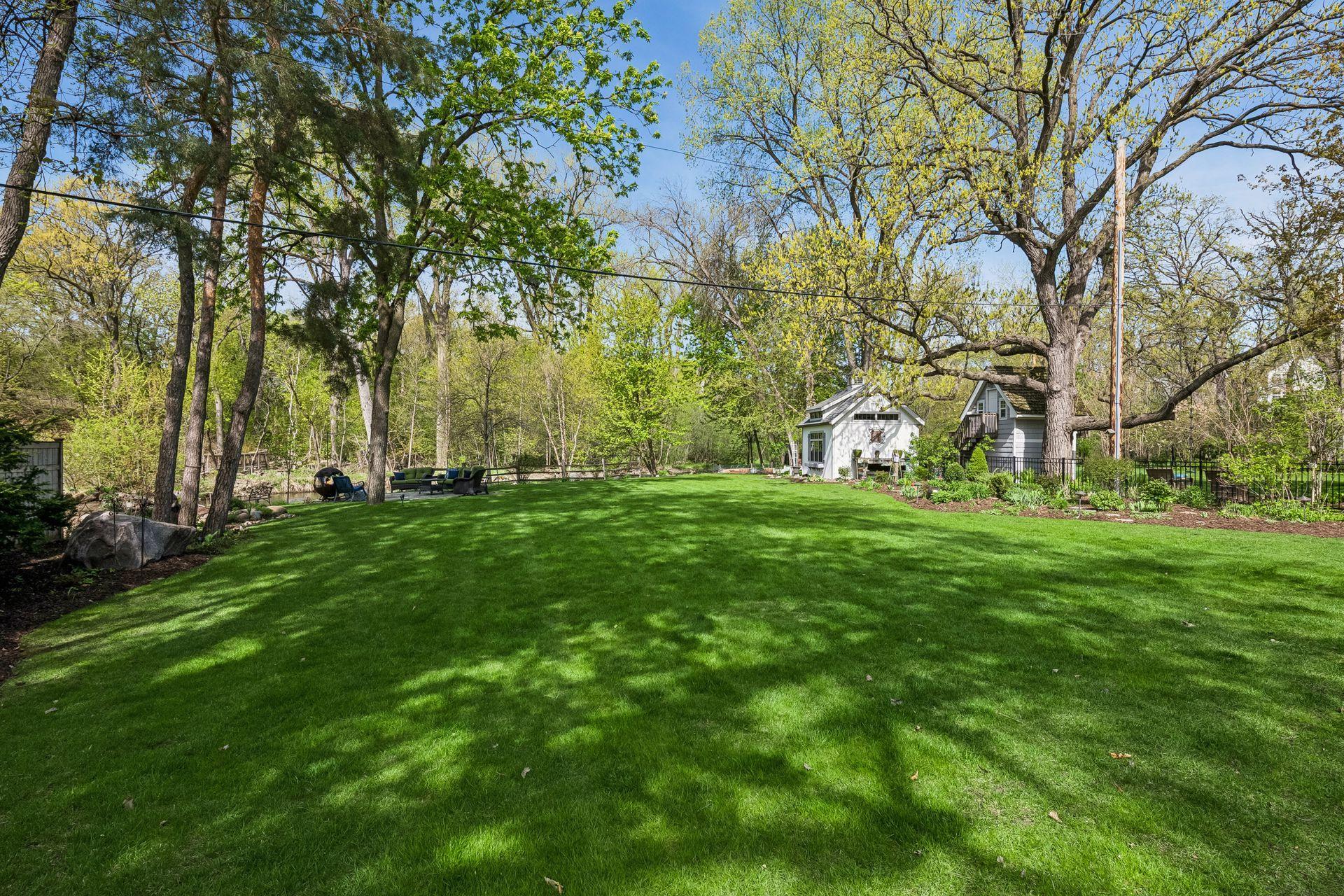 The property extends into the water and is adjacent to the park, with parkland across the creek as well
