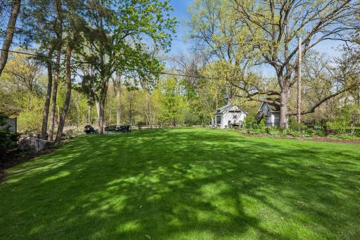 The property extends into the water and is adjacent to the park, with parkland across the creek as well