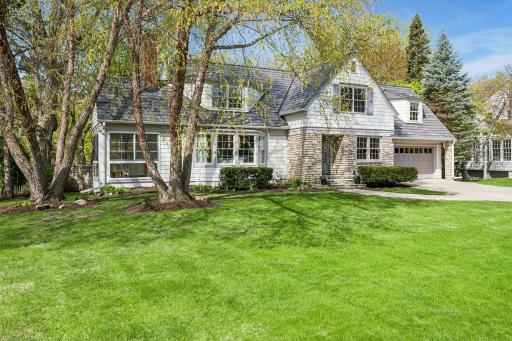 Charming roof lines and covered stone entry