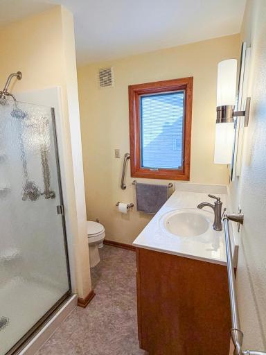 Main floor 3/4 bath with updated fixtures and shower